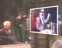 Lister shows Kryten his photo's